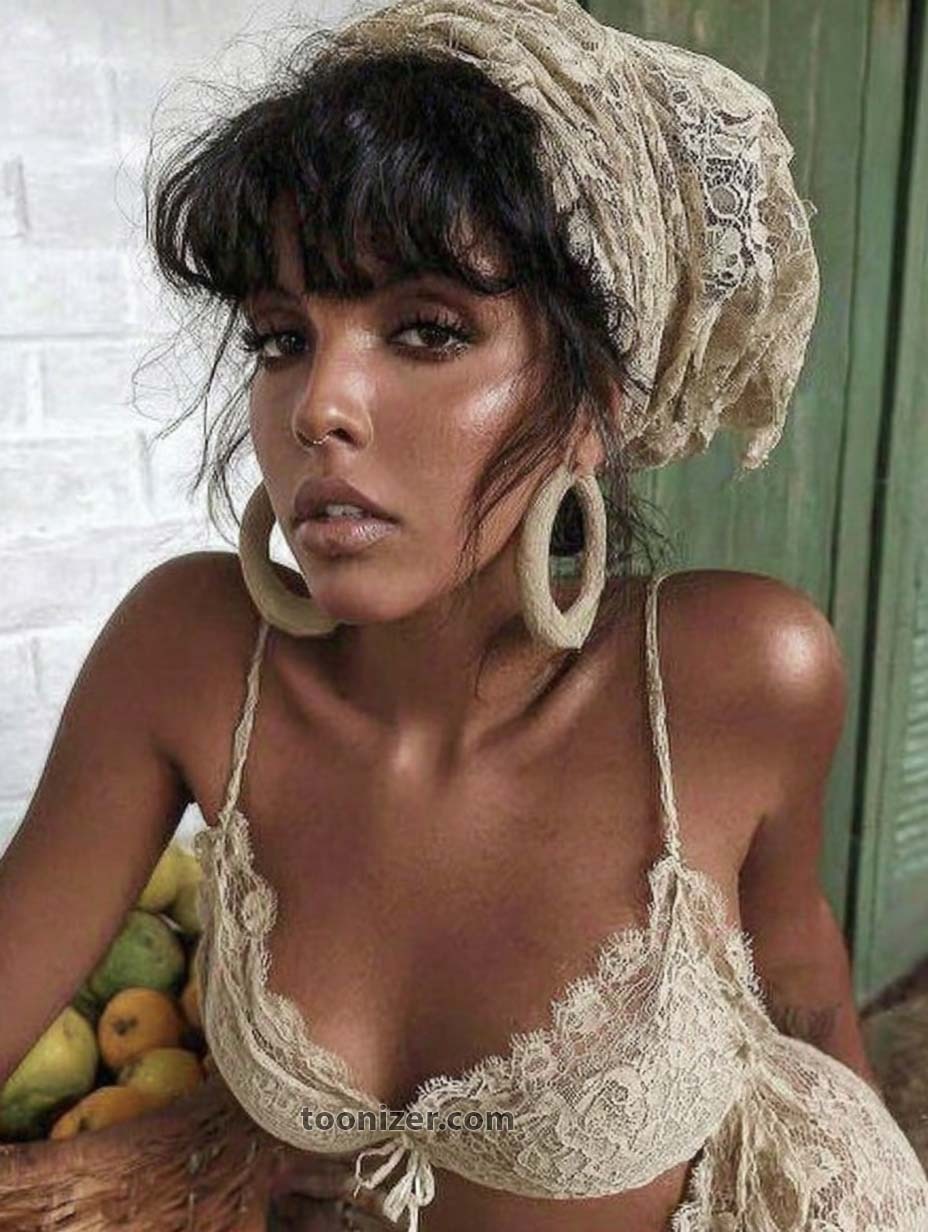 Woman wearing lace outfit and headscarf, posing outdoors.