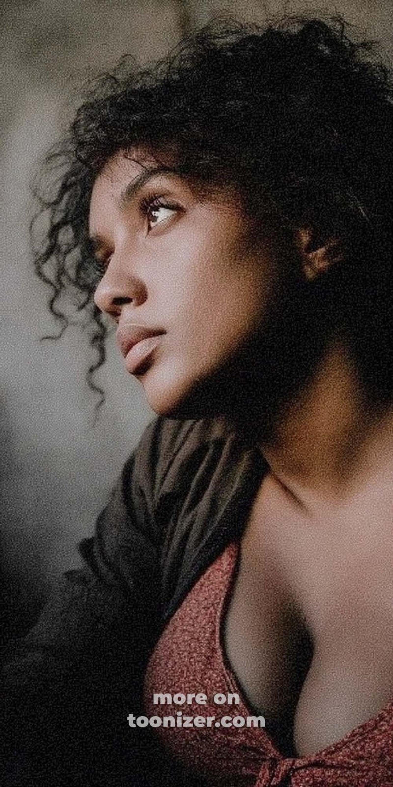 Pensive person gazing upward, curly hair, text overlay.