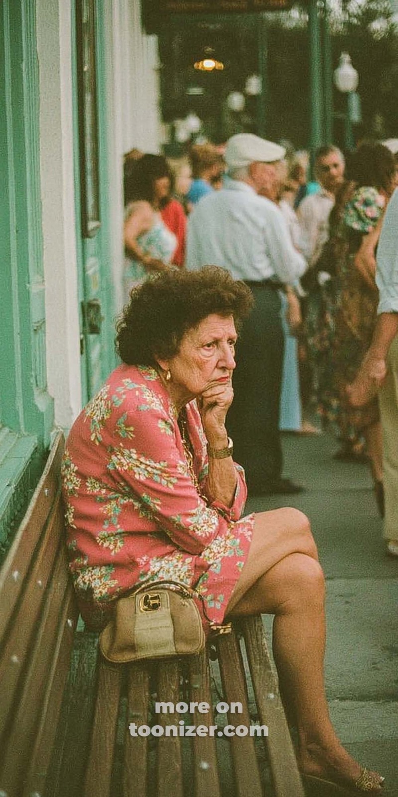 Pensive elderly woman sitting outdoors on a bench.