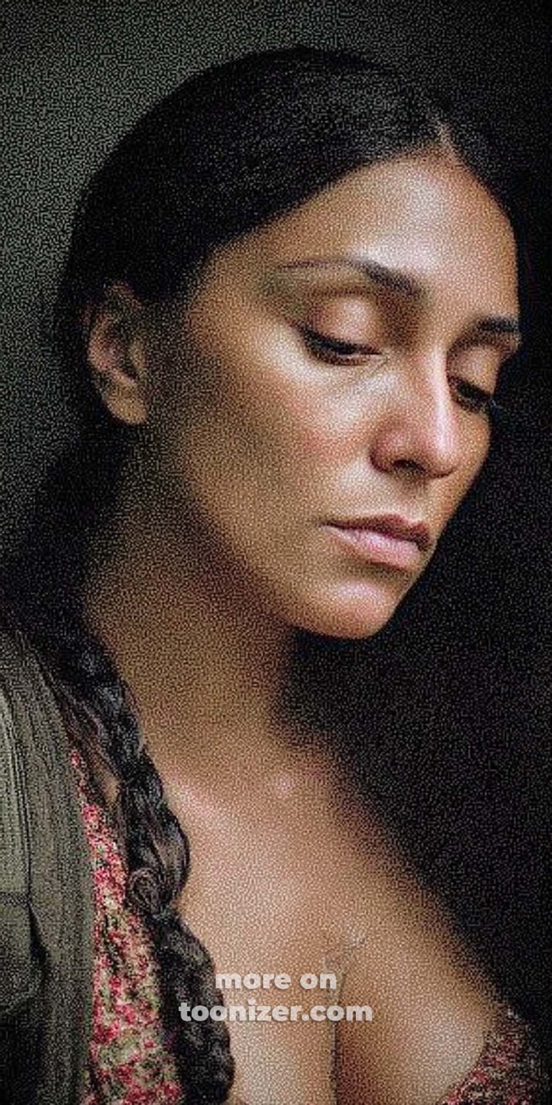 Portrait of a thoughtful woman with braided hair.