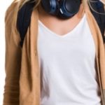 Smiling person with headphones and backpack