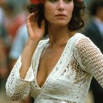 Woman in crochet top with red flowers