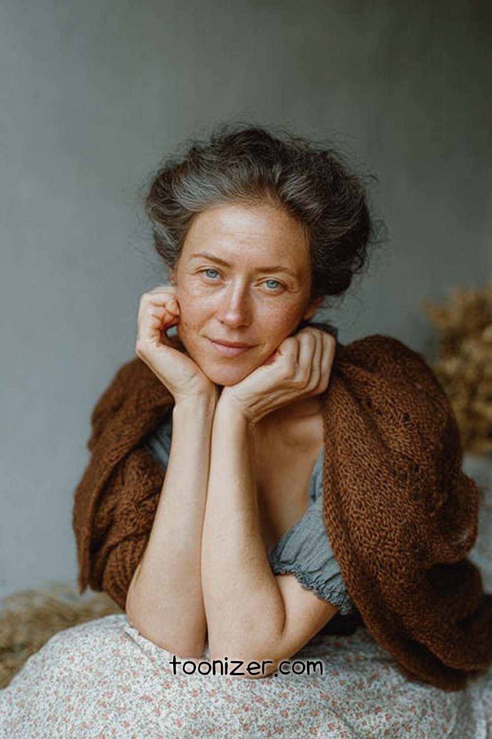 Woman in brown shawl looking serene