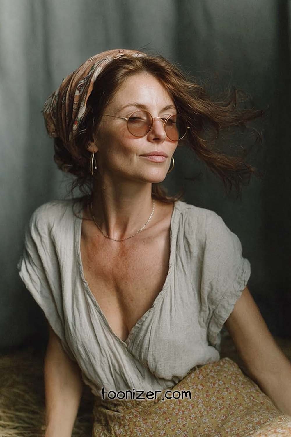 Woman with sunglasses and headscarf