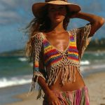 Woman in straw hat on sunny beach