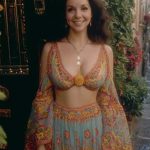 Woman in colorful bohemian dress smiling