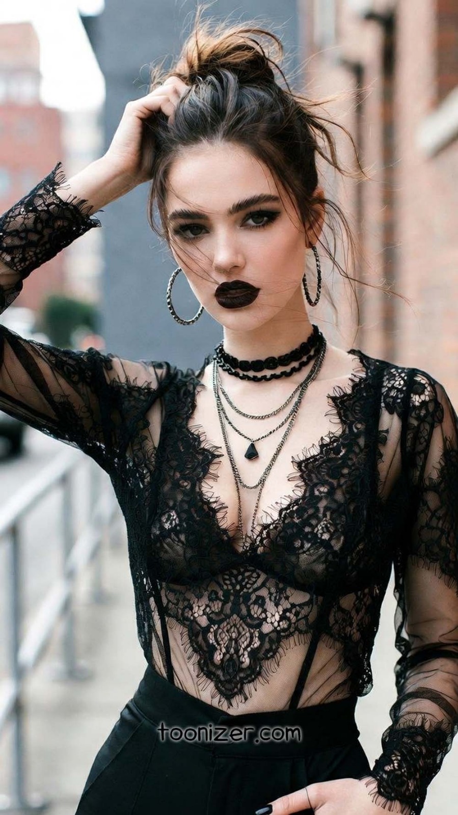 Woman in gothic fashion clothing outdoors