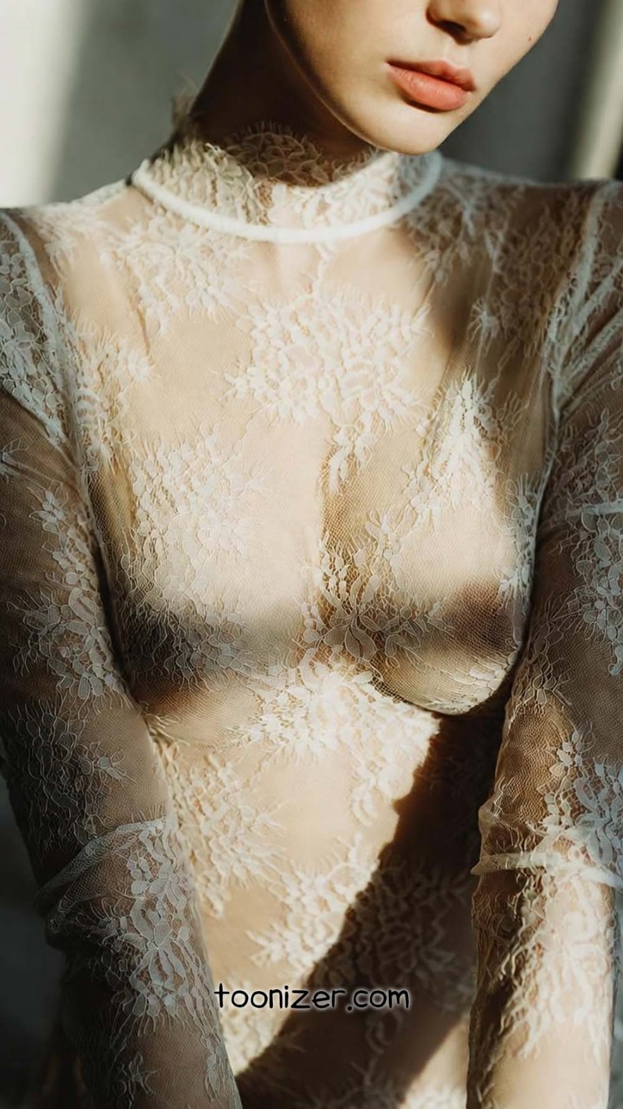 Close-up of person in lace attire