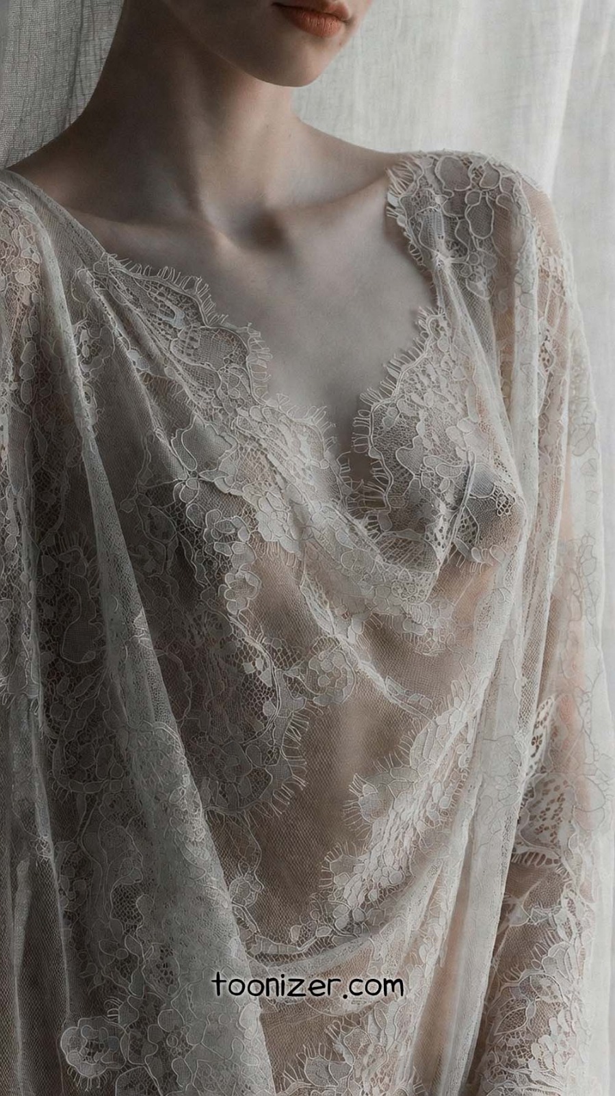 Sheer lace fabric draped over a woman