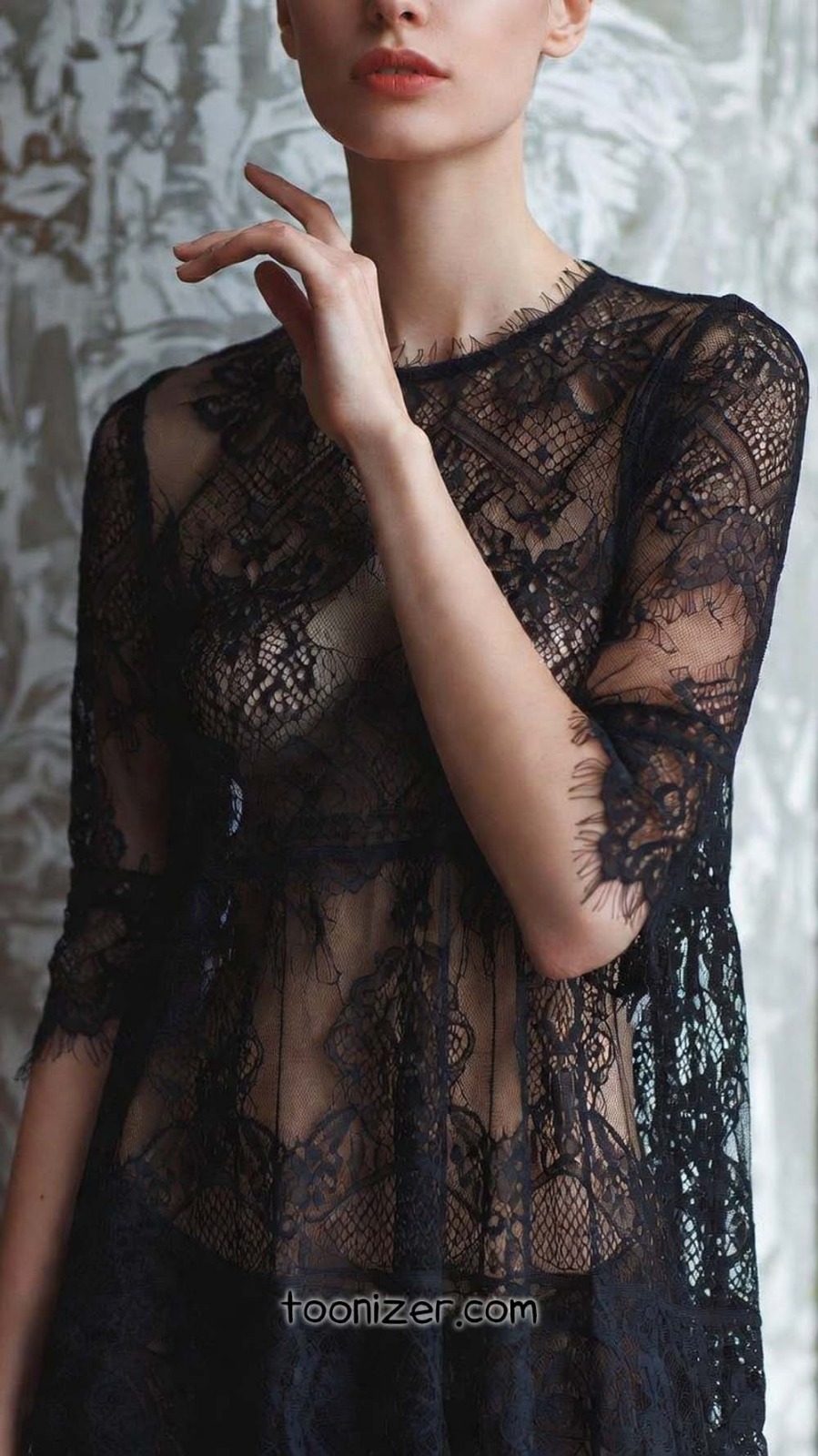 Woman in elegant black lace dress