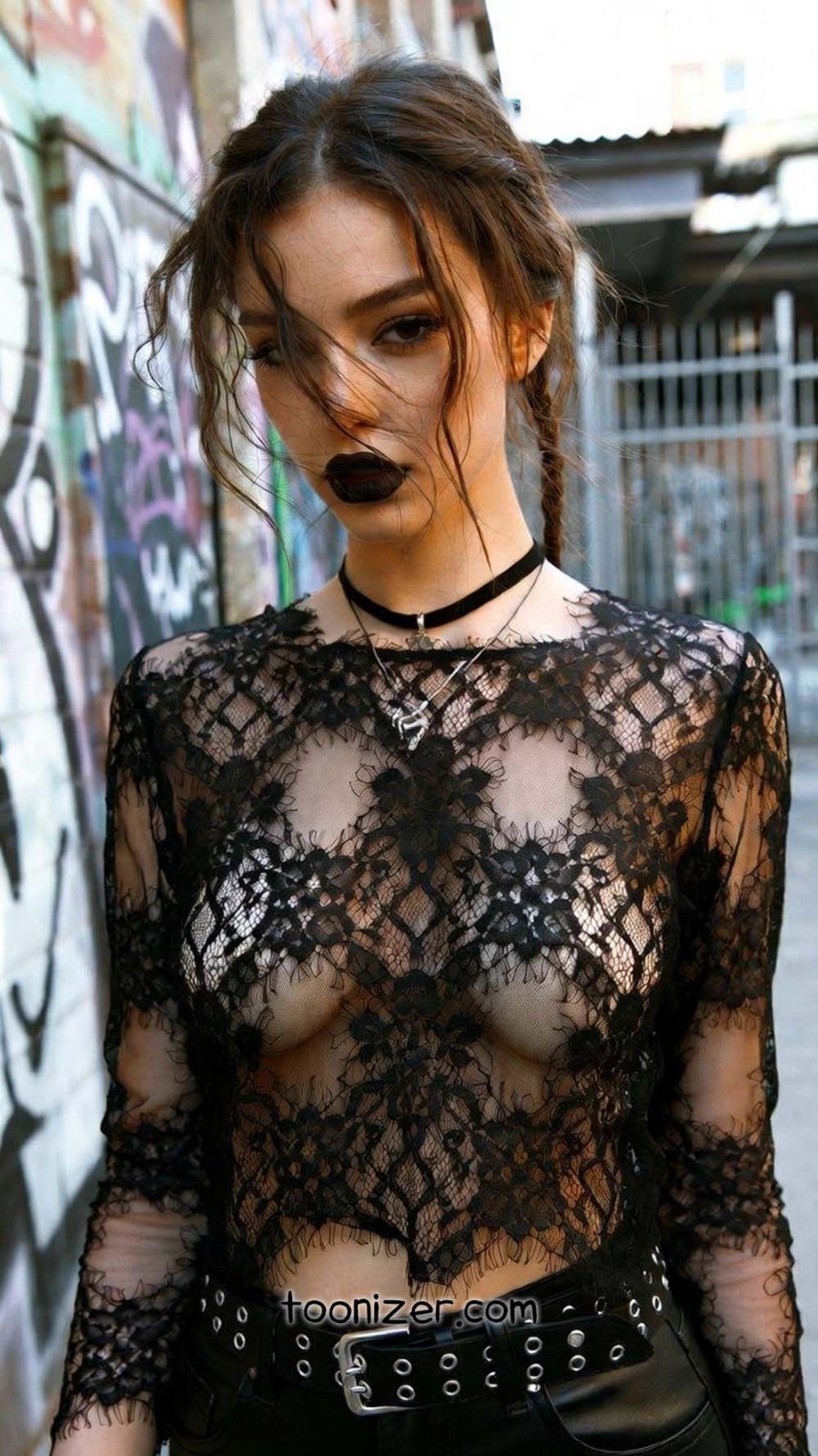 Woman in black lace top outdoors