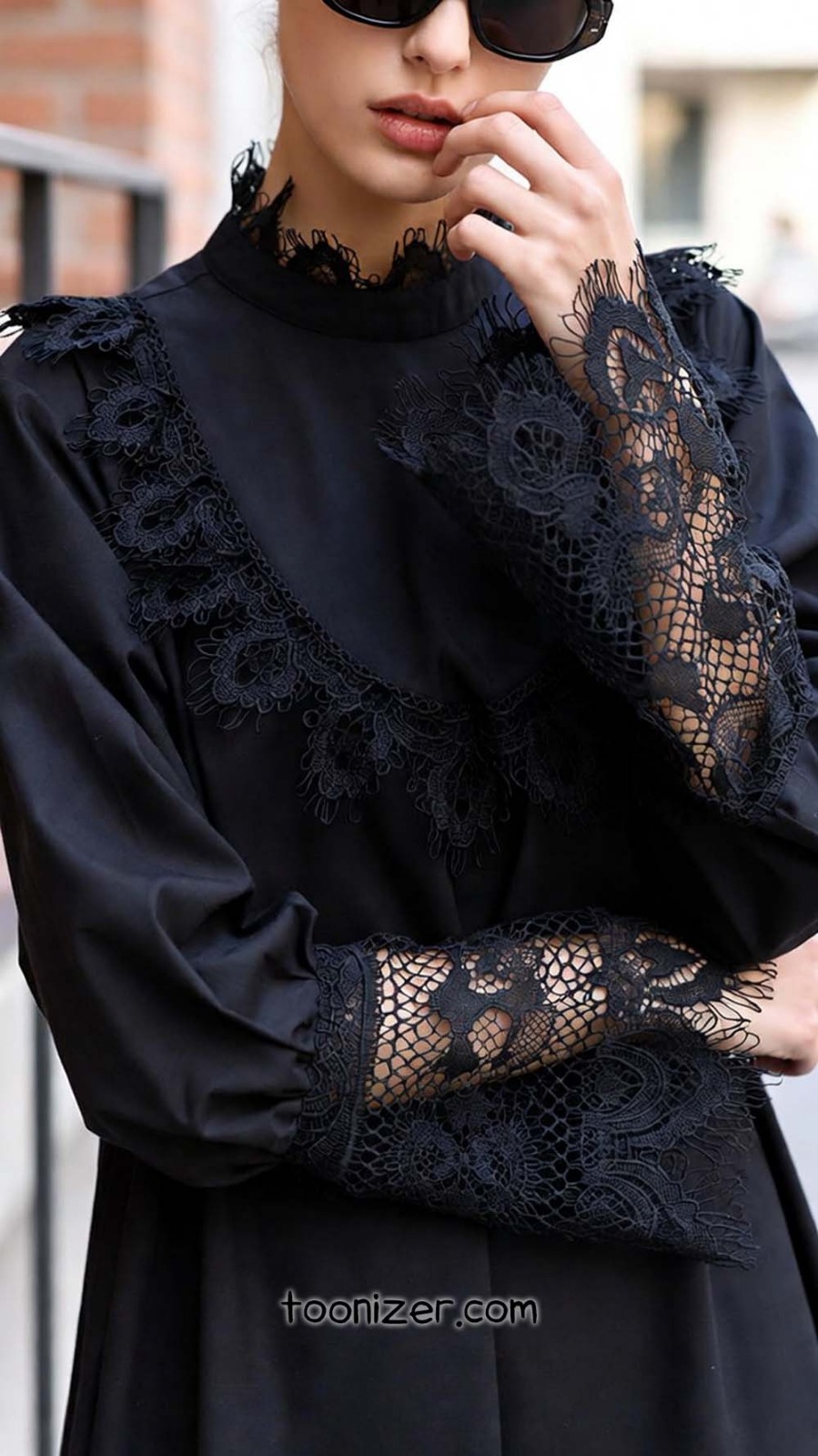 Elegant black lace dress with sunglasses