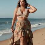 Woman in floral dress on a beach