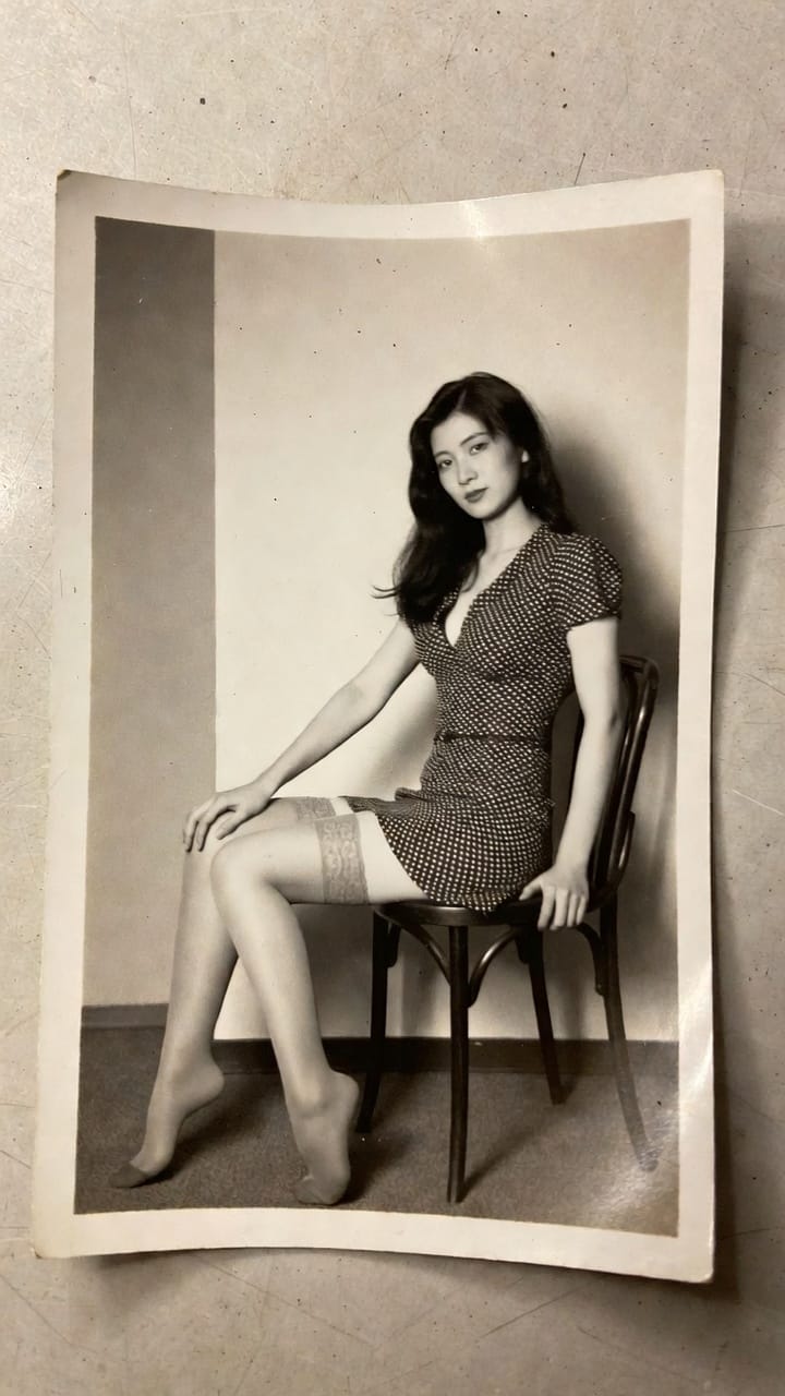 Vintage black-and-white portrait of woman seated on chair