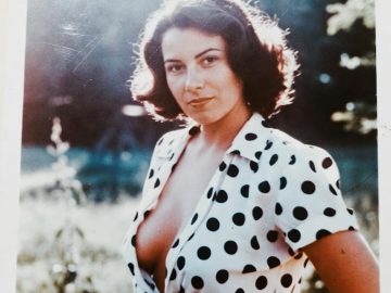 Woman in polka dot blouse outdoors portrait