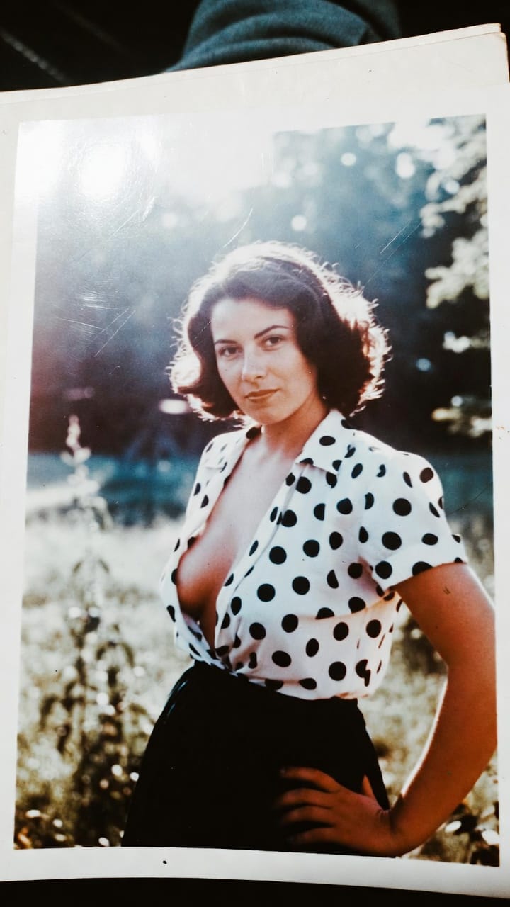 Woman in polka dot blouse outdoors portrait