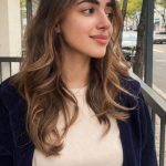 Young woman smiling outdoors