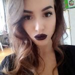 Woman with dramatic makeup and wavy hair