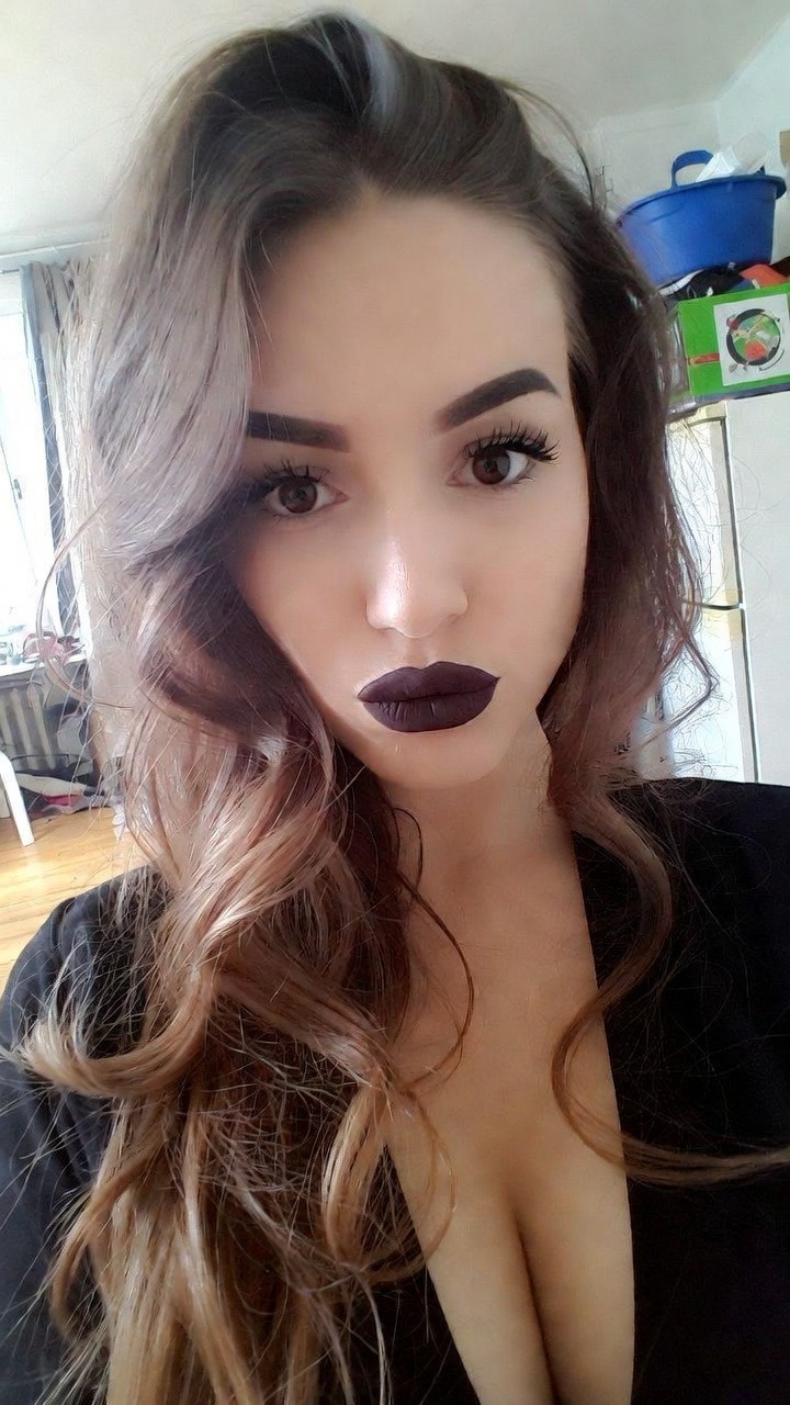 Woman with dramatic makeup and wavy hair