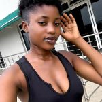 Woman posing in front of a building