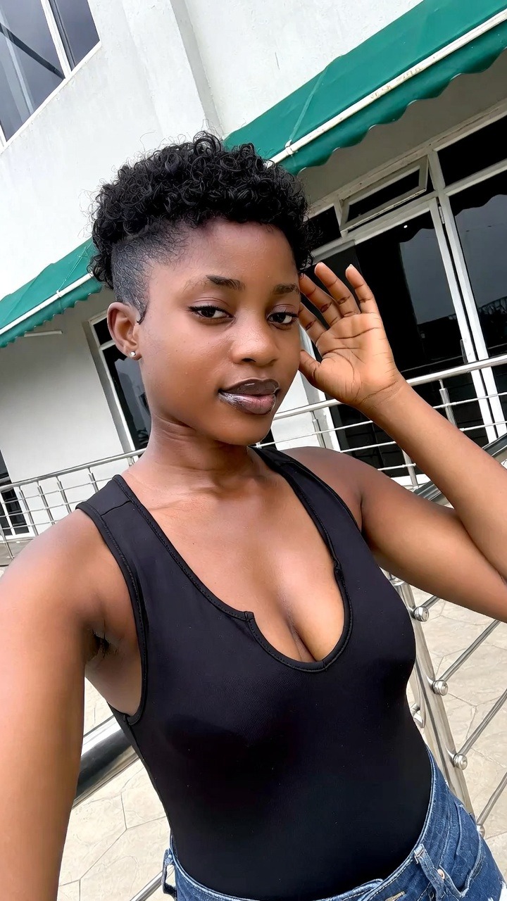 Woman posing in front of a building