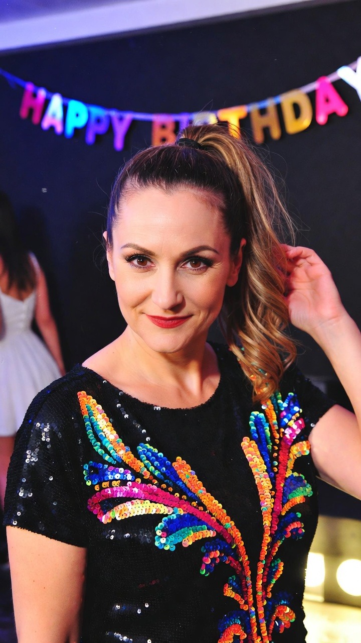 Woman at birthday party in colorful dress