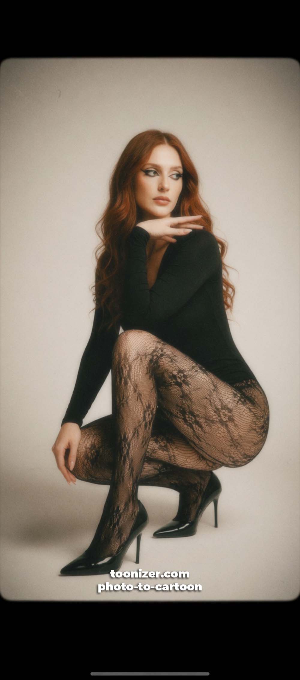 Woman in black bodysuit and lace tights posing