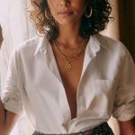 Woman in white blouse and floral skirt