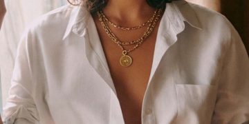 Woman in white blouse and floral skirt